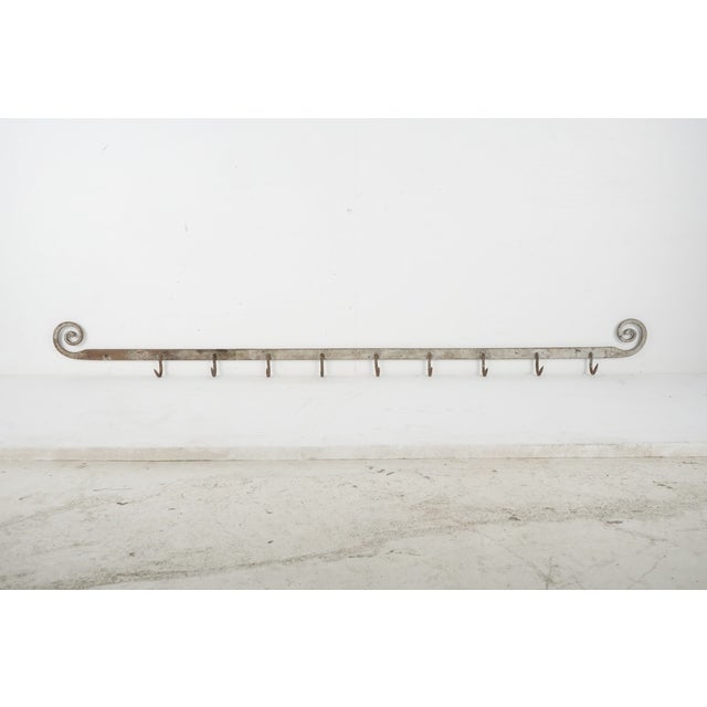 Antique Industrial style butcher's meat hook rack made of wrought iron with distressed silver paint. Originally mounted on...
