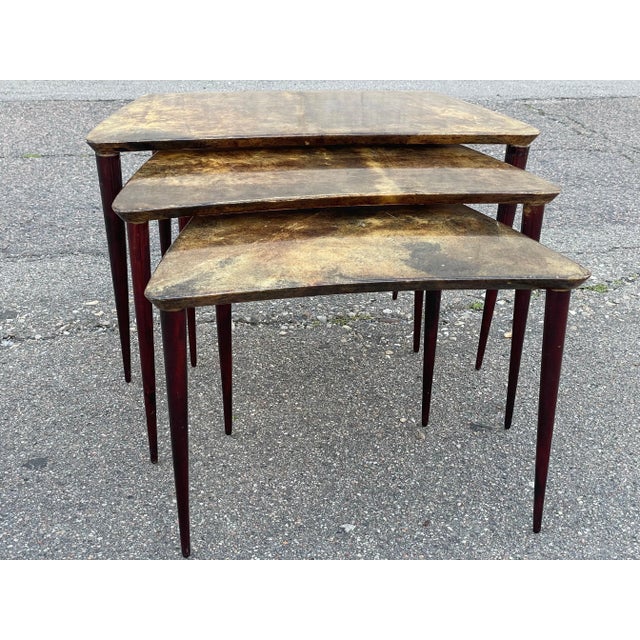 Original Aldo Tura nesting tables. An outlier in the world of Italian mid-century furniture. The beautifully crafted...