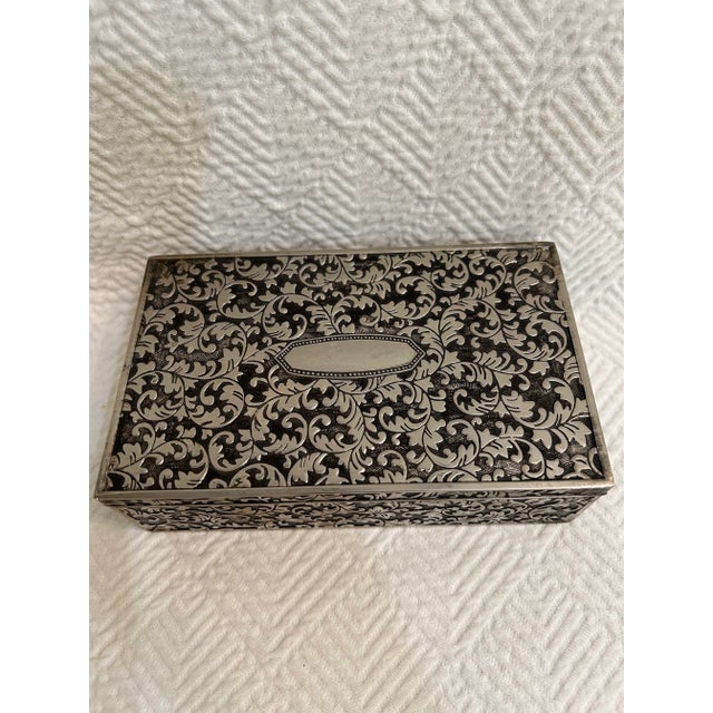 Elegance from days gone by… that’s what this silver plate jewelry box is. The silver plate is embossed with a foliage...