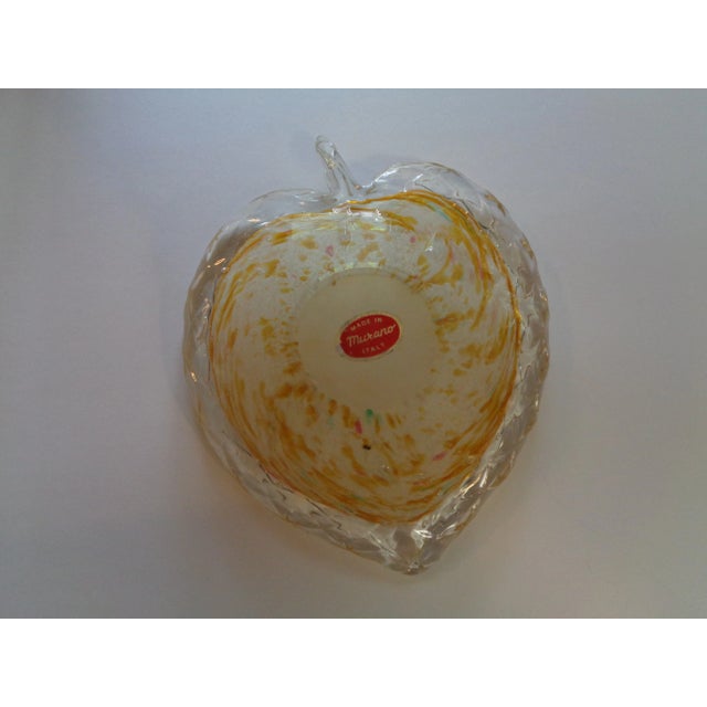 A vintage Murano bowl for candy, nuts etc. It is shaped like an apple and has yellow, gold flecks on white and surrounded...
