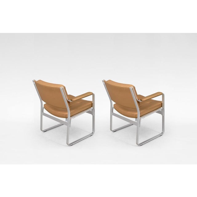 Designed in the 1970s by Karl-Erik Ekselius for JOC Vetlanda, this pair of Mondo armchairs features refreshed light brown...