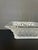 This Is a Lalique "Roses" Square Bowl, Featuring a Frosted Crystal Exterior Adorned With a Detailed Relief Pattern of Rose...