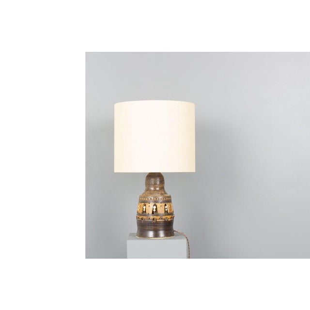 A striking sculptural table lamp by renowned french ceramicist georges pelletier, handcrafted in the 1970s. This piece...