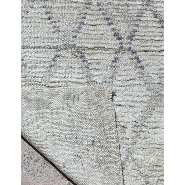 Vintage Moroccan Beige and Gray Azilal Rug This vintage Azilal rug traces a loose diamond lattice across a beige and gray...