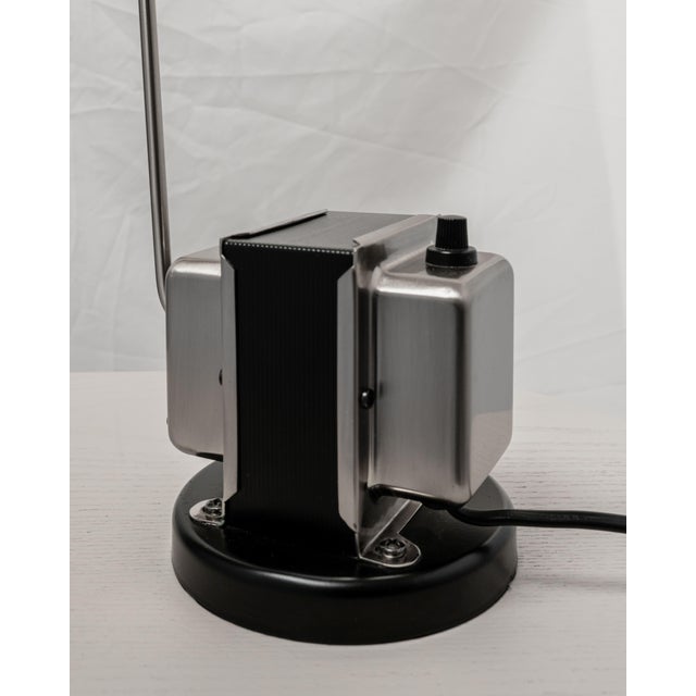 The minimalist desk lamp that launched Lumina - the iconic Daphine Table Lamp is now on display in Museums of Modern Art...