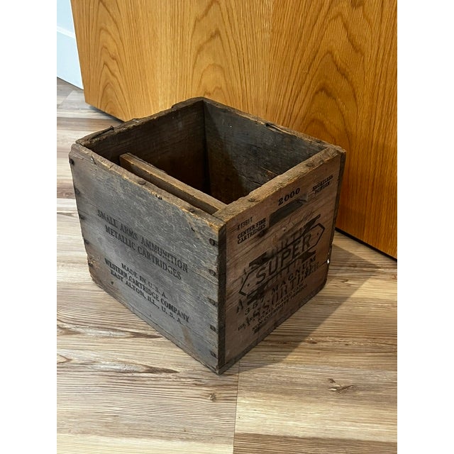 This antique Western Cartridge Company wooden ammunition box features branded text for "SUPER-X" and ".357 Magnum"...