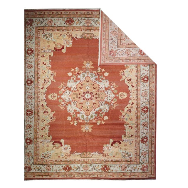 This Anatolian interpretation of a Persian Tabriz model features a tastefully abrashed open red subfield, centred by a...