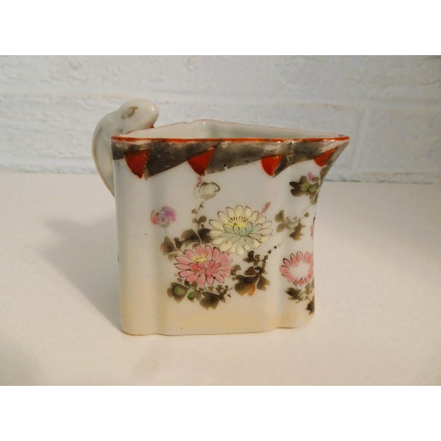 This little rectangle shaped porcelain pitcher has a lot of character from the shape to the handle. I've tried to figure...