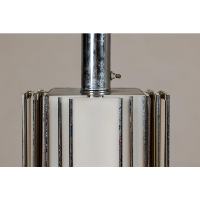 An Art Deco style skyscraper table lamp from the Midcentury period with two lights. Envelop your home in the captivating...