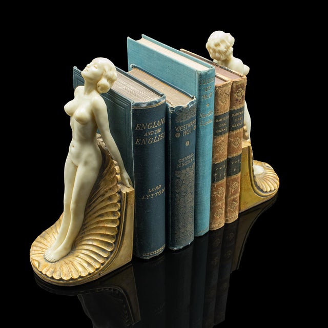 This is a pair of vintage figural bookends. An English composite nude figure in Art Deco revival taste, dating to the mid...