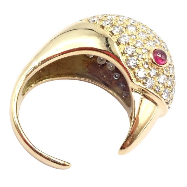 This vintage Tiffany & Co. Elsa Peretti bird ring is crafted in 18k yellow gold with a sculptural open band design....