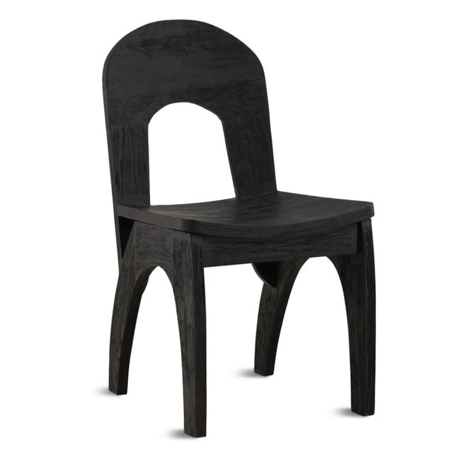 Rich modern black finish teak wood dining chair. Rounded back with cutout, for an upside down U shape. Slight curved seat...