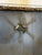Large-scale vintage wall sculpture featuring a bold Brutalist composition with welded metal forms and radiating brass-...