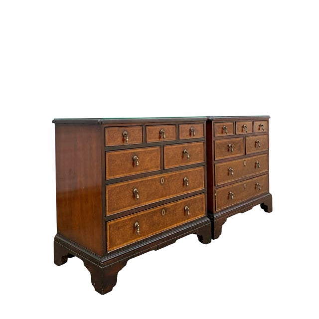 Offered here is a pair of Baker Furniture Milling Road dressers or bachelors chests. They are constructed of cherry wood...