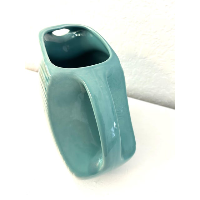 Vintage Homer Laughlin Fiesta ware ceramic disc 28 ounce pitcher in turquoise. Marked "Fiesta Made in U.S.A. " (Note:...