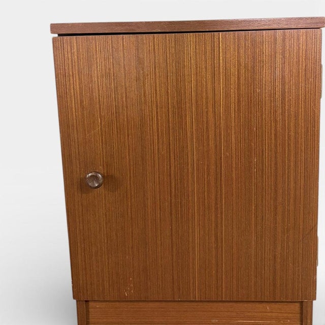 The vintage teak bedside cabinet offers a stylish and practical bedside storage solution, combining timeless mid-century...
