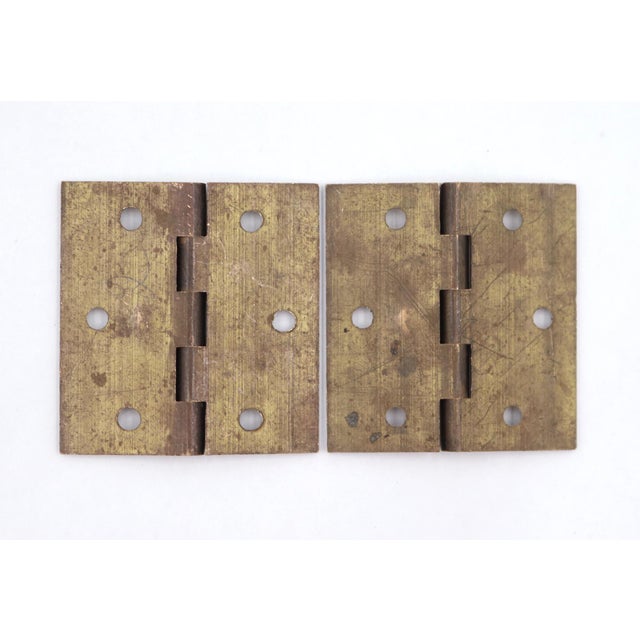 These cabinet door hinges are made of brushed brass with flat tips, five knuckles, and a template hole pattern. Made in...