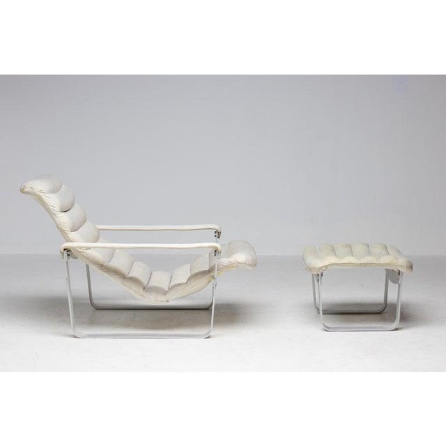 Ilmari Lappalainen “Pulkka” lounge chair and ottoman, by Asko, Finland. Original white leather cushions with removable...