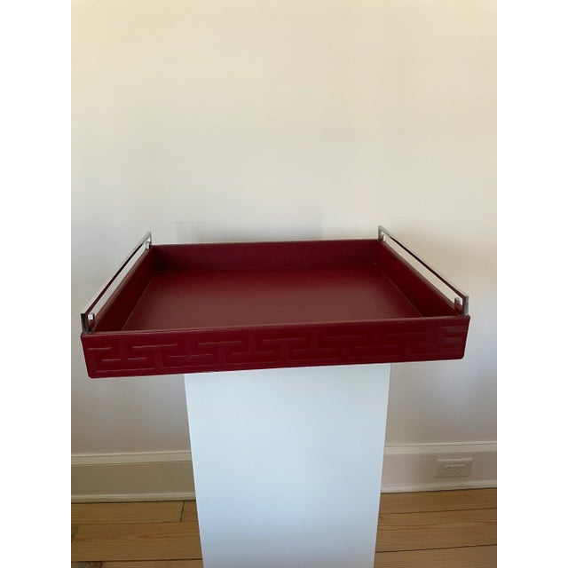 Some slight scratches on leather and hardware as seen in photos. Measurements 20x 16x 2 1/2”