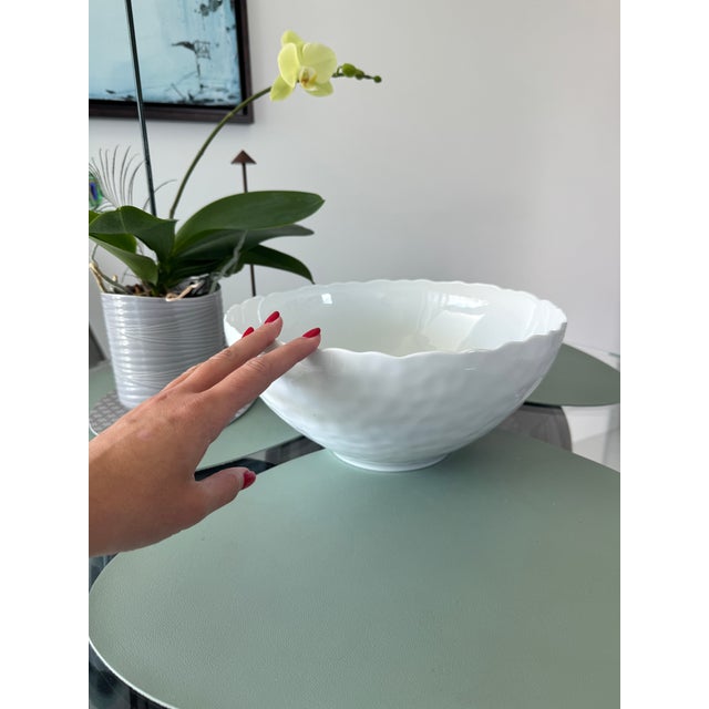 Elegant large porcelain bowl by the renowned French porcelain house Bernardaud. This sculptural piece comes from the...
