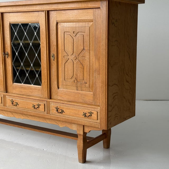 c. 1960s. Denmark. Quarter sawn oak construction with glass pane doors. Two original keys are still intact.