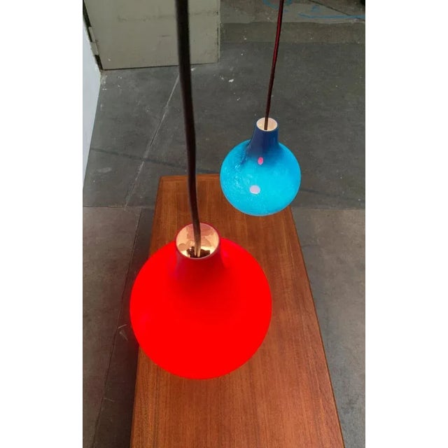Mid Century Glass Pendulum from the renowned manufacturer Putzler in very special colors. The luminaire body made of red...