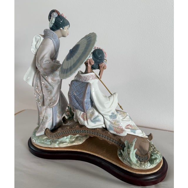 This is Llador "Springtime in Japan," a porcelain figurine, number 1445. It was sculpted by Salvador Debon and first...
