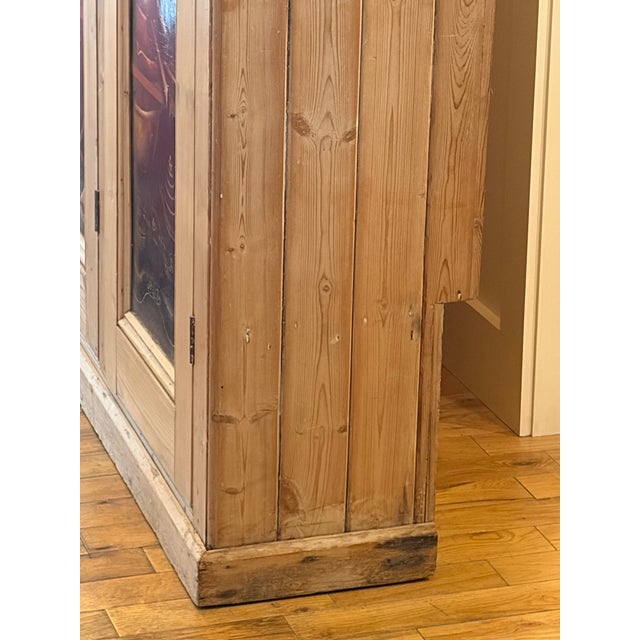 Up for sale in Sunapee Harbor is an Antique 19th Century English Scrubbed Pine Cupboard. This cupboard consists of 6...