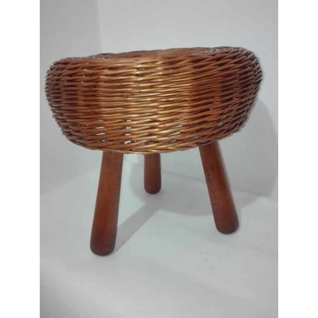 Pair of Tony Paul designer stools. Hand-woven wicker and solid wood legs. Excellent condition. Minor imperfections in the...