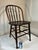 Antique Windsor bow-back or hoop-back chair. The timeless wooden chair is from the late 19th century, made by S Bent &...
