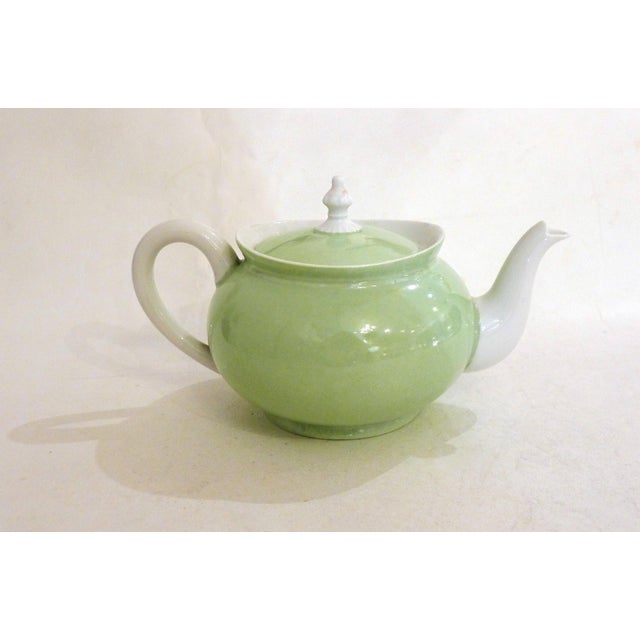 Small antique teapot, rounded and bulbous body, openwork handle, small flared neck for the lid, with a pretty, ornate knob...