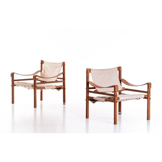 Excellent pair of safari chairs model Sirocco in good condition. Original leather and canvas. Designed by Arne Norell,...