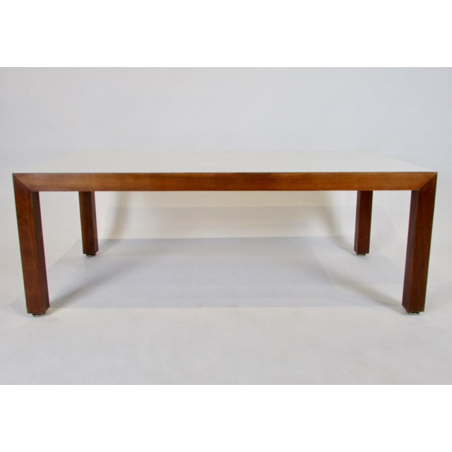 This modernist 1960s era clean-lined rectangular shaped coffee table offers mid-century style with plenty of durable...