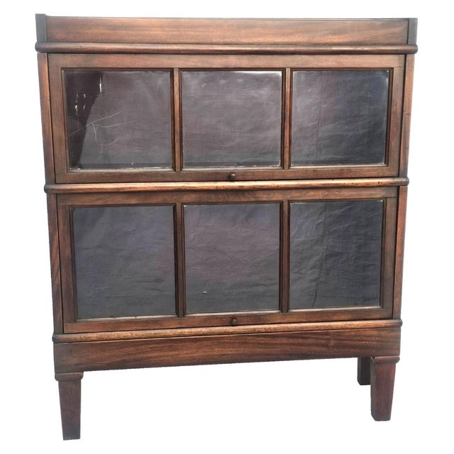 A handsome and highly functional antique Macey mahogany barrister bookcase, dating to the early 20th century and designed...