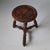 Antique, likely French, wooden stool with carved seat. In beautiful condition.