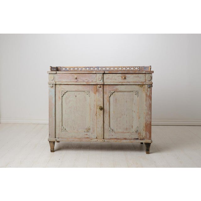 Antique gustavian elegant sideboard from northern Sweden. Straight classic shape. The sideboard is made by hand in solid...