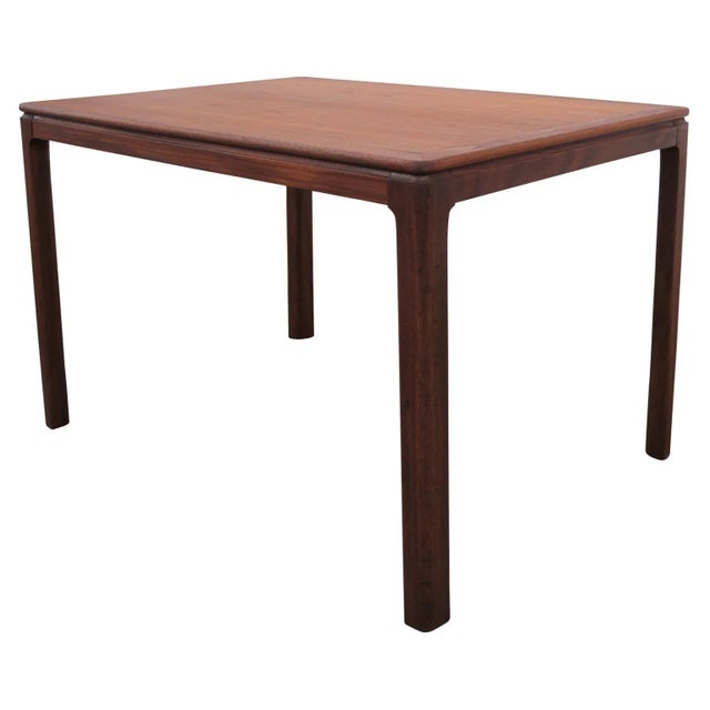 Danish rectangular side table in the Mid-Century Modern style. The tabletop and legs are beautifully constructed from...
