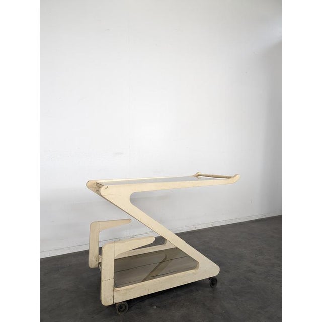 White Lacquered and Smoked Glass Z-Shaped Rolling Serving Cart, 1970s, in Very Good conditions. Designed 1970 to 1979