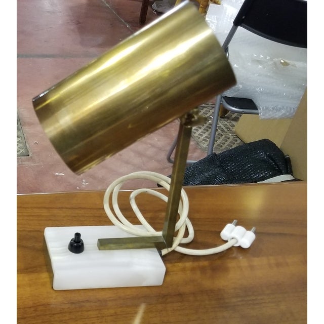 Vintage gold-coloured/brass cylinder lamp desk lamp. Beautifully sleek design. Minimalist desk lamp with brass head and...