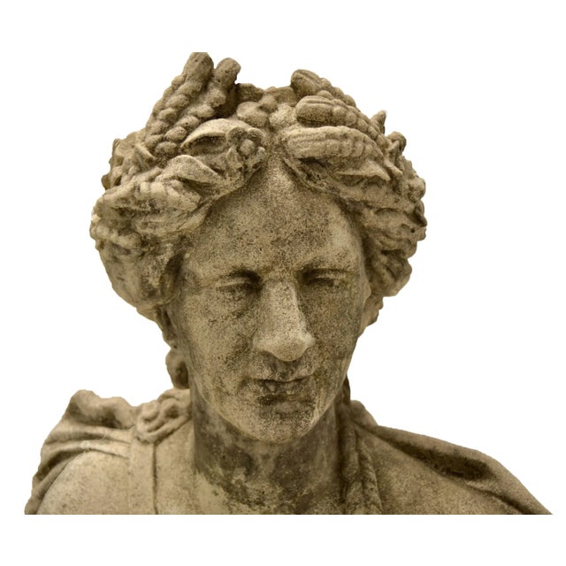 A 19th century carved stone bust. The handsome figure in Greco-Roman attire with toga draped over the shoulder and a...