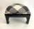 Chinoiserie inspired black lacquered square ottoman with new linen upholstery in a bold charcoal and white plaid trimmed...