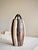 Mid-century studio pottery vessel, hand-thrown in stoneware with applied loop handles and a faceted body. The glaze is...