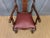 An imposing walnut high back armchair in the queen Anne style. Well constructed in solid walnut, the frame is strong and...