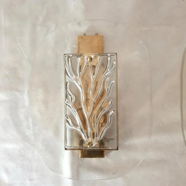 Pair of large Mid Century Modern Murano glass sconces, Italy, 1970s. The pair of Italian sconces is made of a brass frame...