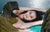 Amidst Indonesia's dinosaur island, a woman rests, eclipsing her surroundings in size. Her presence commands awe, a...