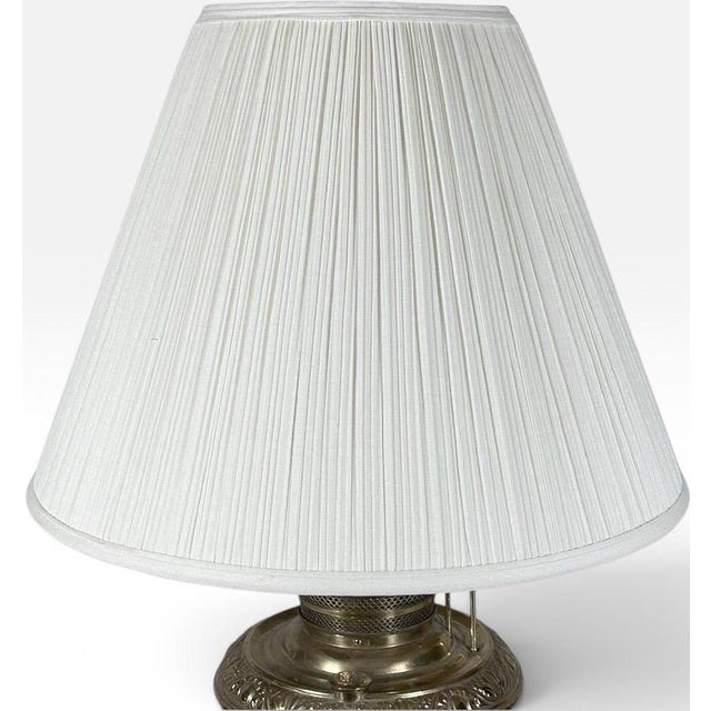 Antique Thomas B Adams and Sons Electrified Brass Oil Lamp Bring a rich layer of historic charm, warm metallic texture,...