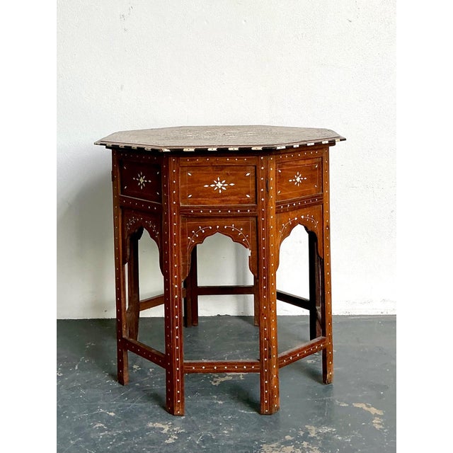 This exquisite vintage octagonal Moroccan side table is a striking example of traditional Moorish craftsmanship, blending...