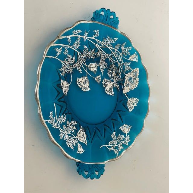 Splendid deep blue translucent glass plate with handles decorated with silver enamelled poppies flowers in Art Nouveau style.
