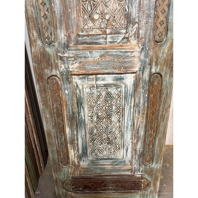 Infused with old-world character and artisan craftsmanship, this vintage carved wooden door brings warmth, texture, and...
