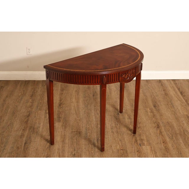 High Quality Custom Mahogany Inlaid Demilune Console Table. Featuring a Center Drawer and Finely Carved Skirt. Central...
